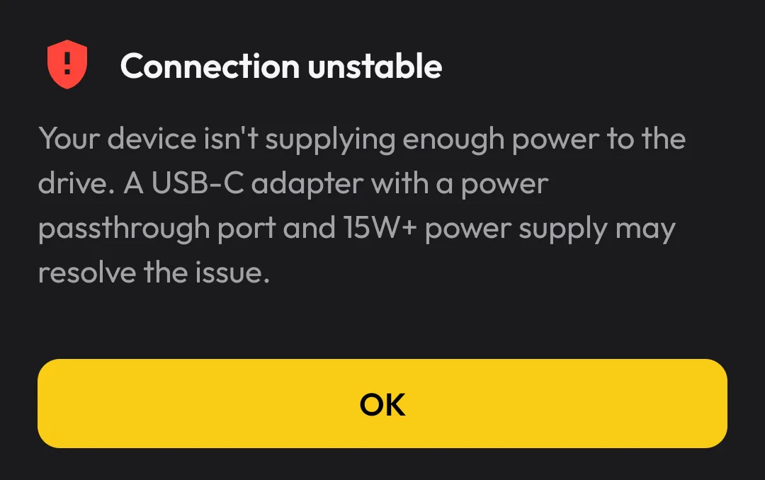 Discs connection unstable warning recommending a USB-C adapter with power passthrough and a 15W or higher supply