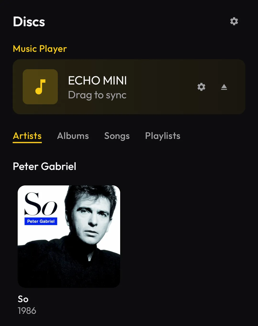 Discs showing a connected music player labelled Drag to sync above the album library